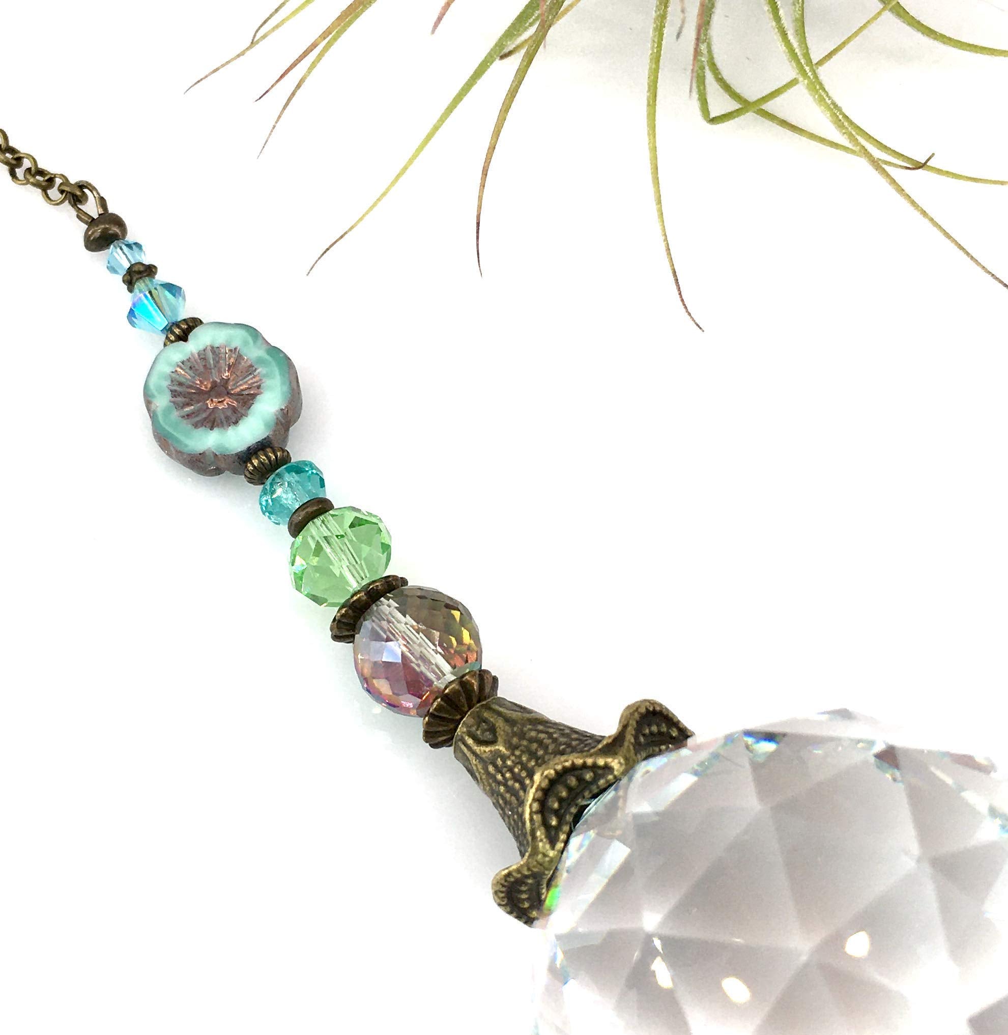 Antique metal findings on crystal sun catcher