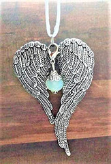 Antiqued metal angel wings ornament with satin cord for hanging