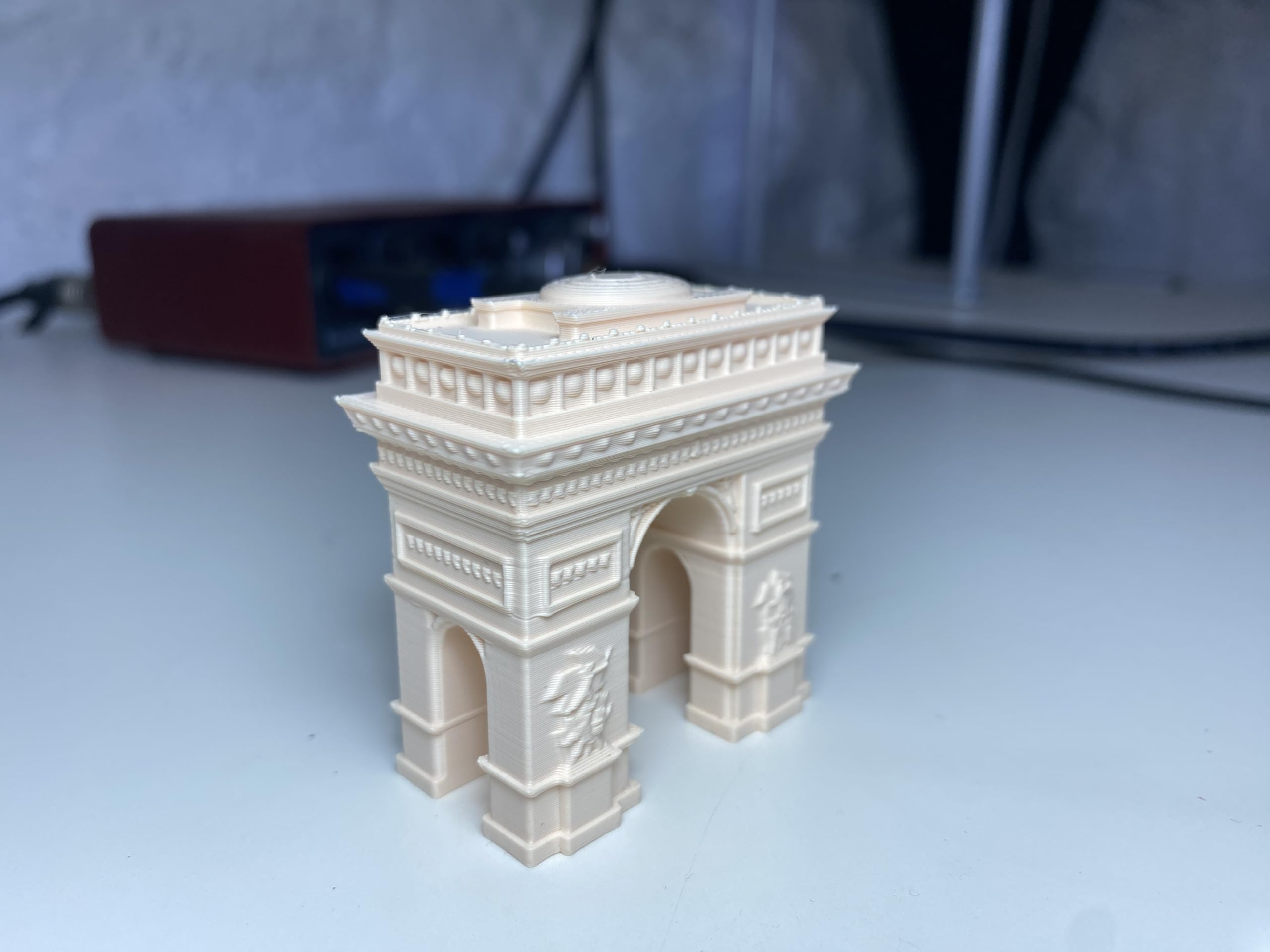 Arc De Triomphe Paris landmark replica displayed on desk