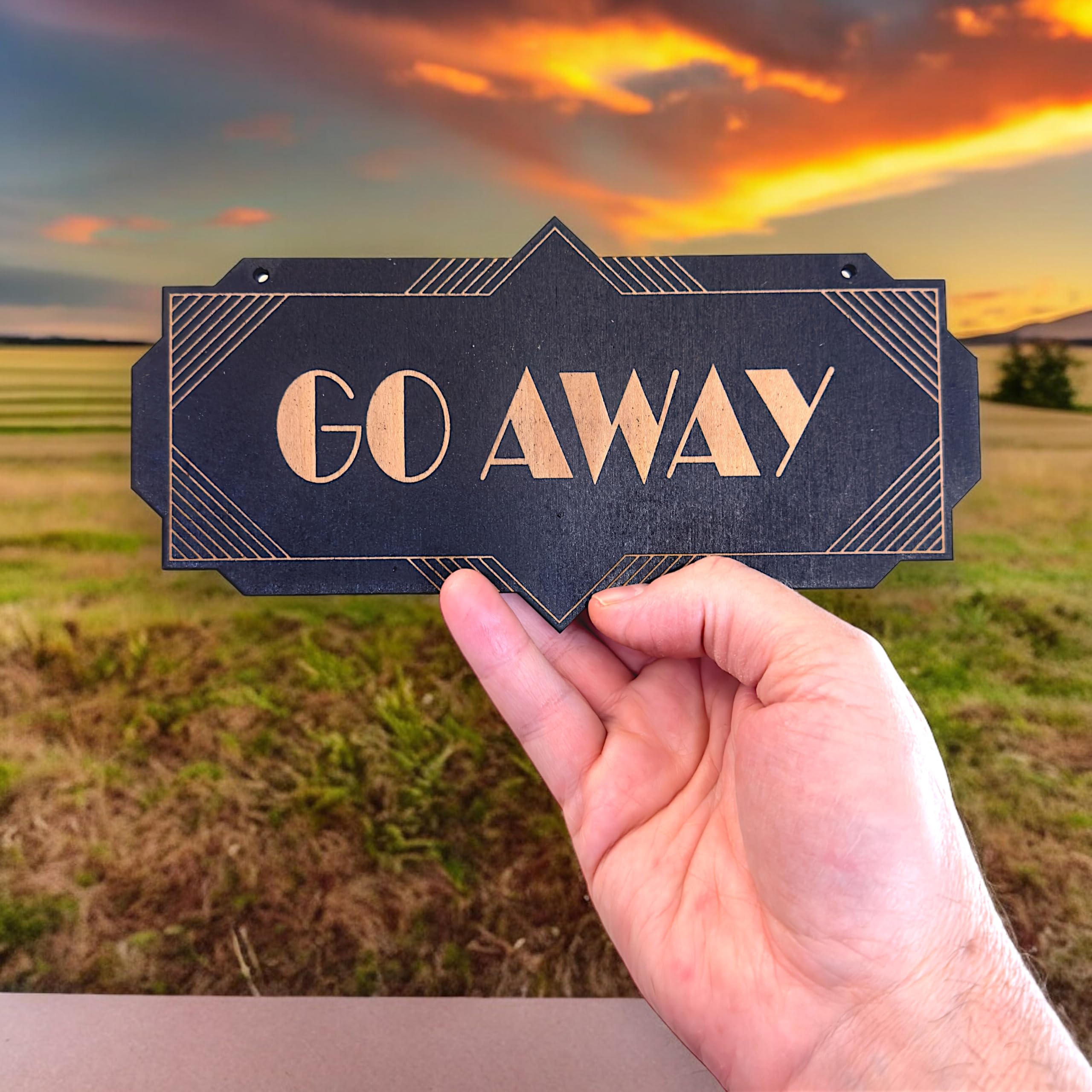 Go Away black wall sign used as a home decor gift option