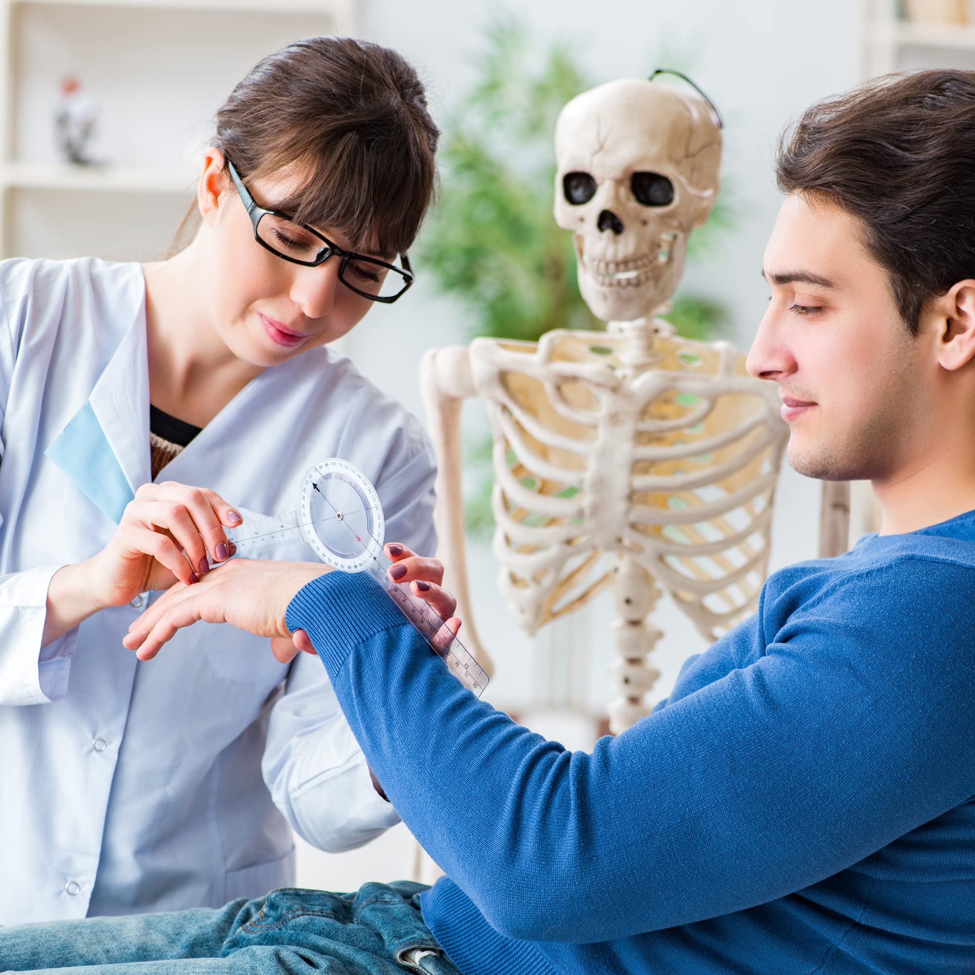 medical professional using goniometer for ROM assessment