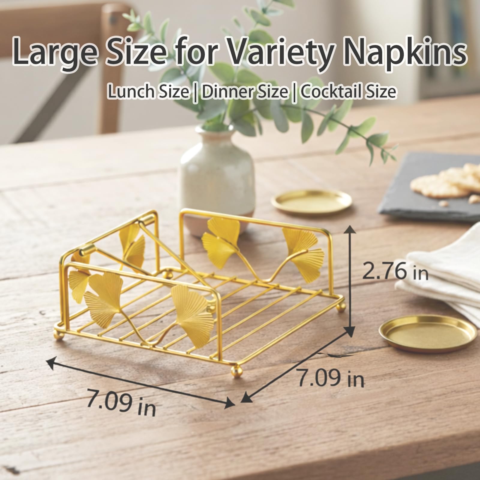 Gold finish napkin holder by Avolander featuring ginkgo leaf design