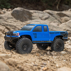 Axial AXI-1219T2 1/24 blue RC Truck base camp 4x4 side view