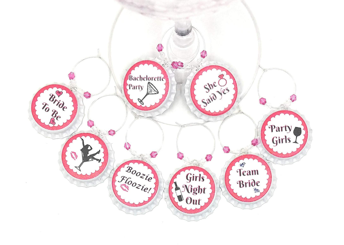 Eight white bottle cap wine charms with hot pink silver and clear beads on silver rings