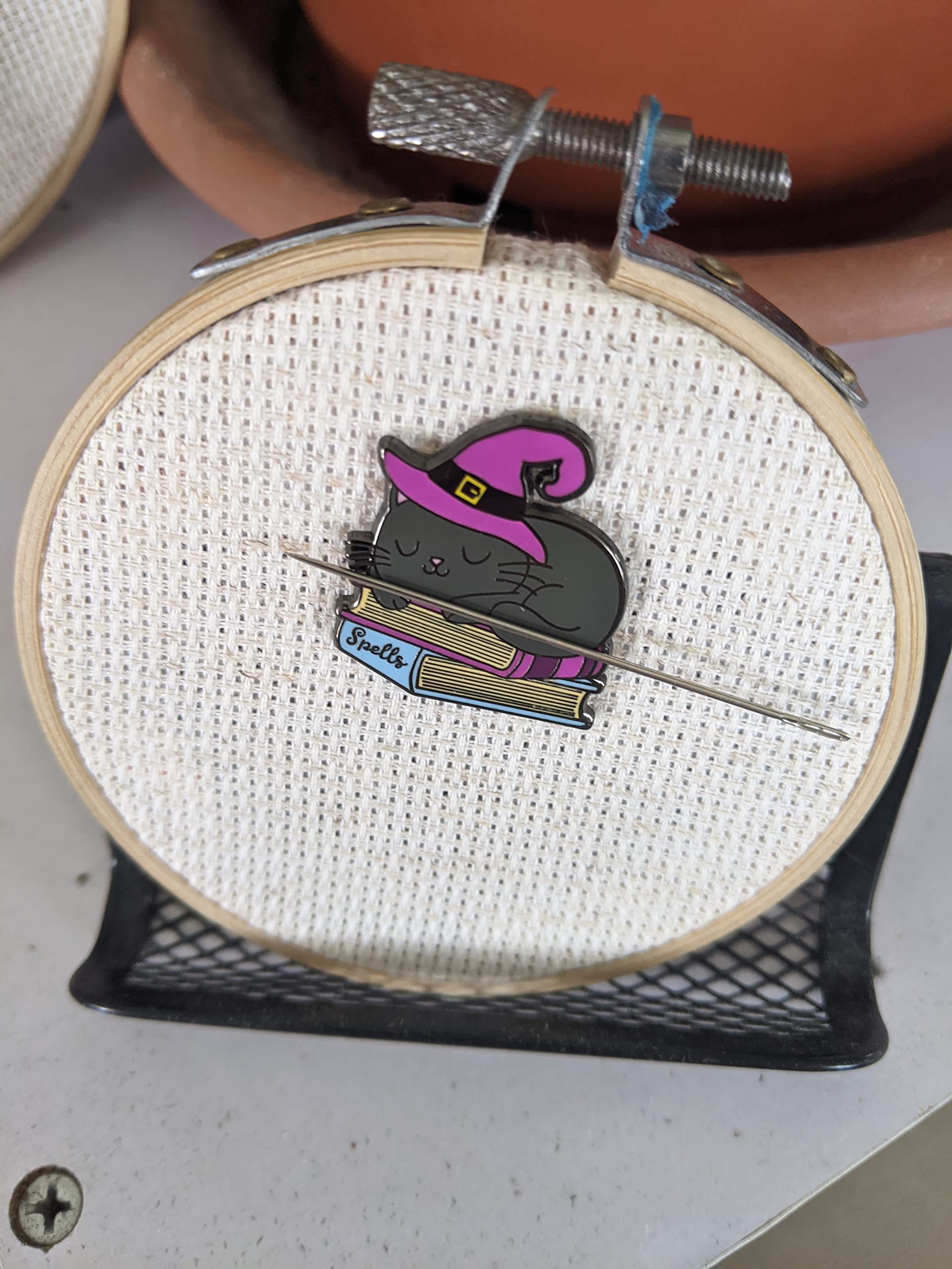 Needle minder shown on a three inch embroidery hoop