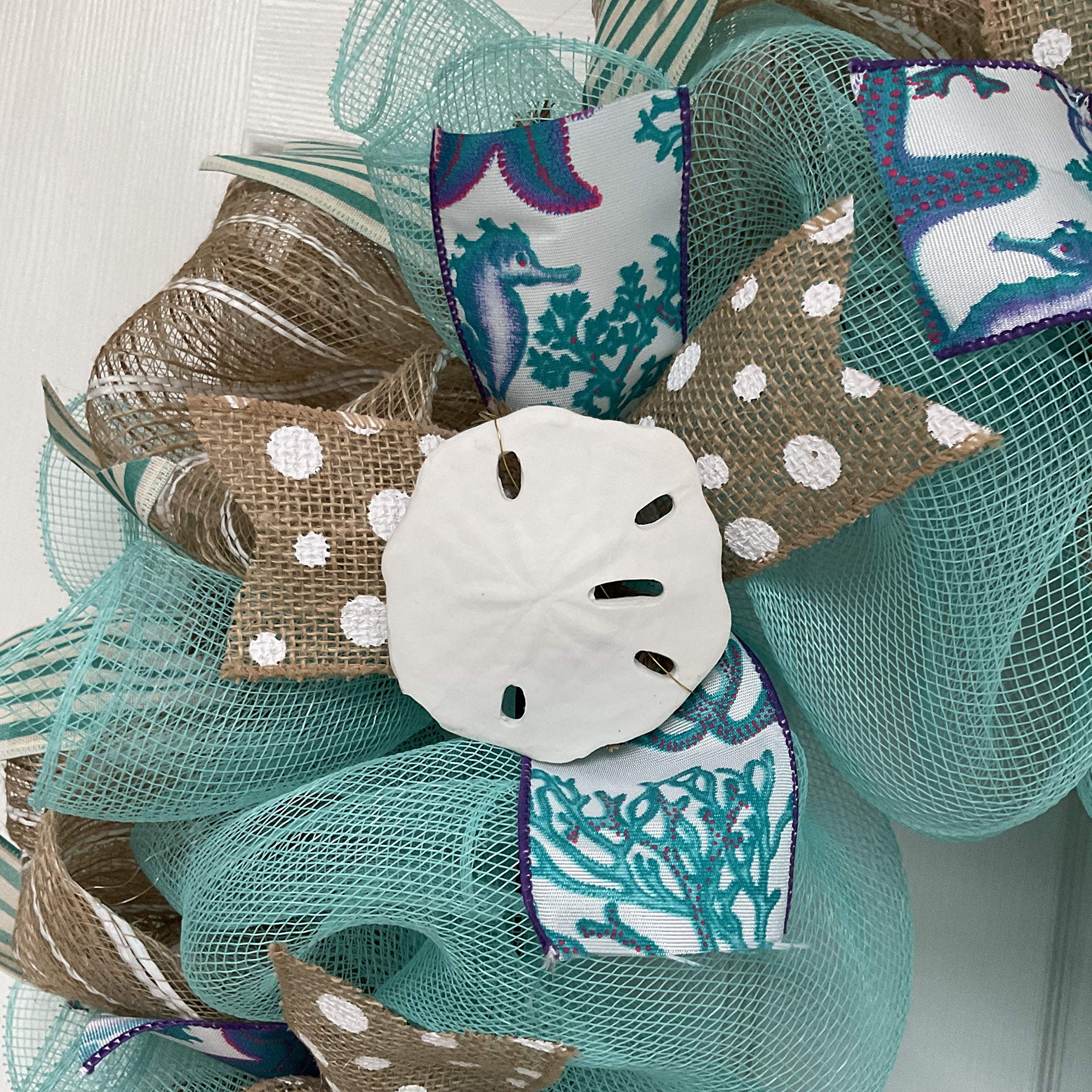 Turquoise and white striped exterior ribbons on wreath