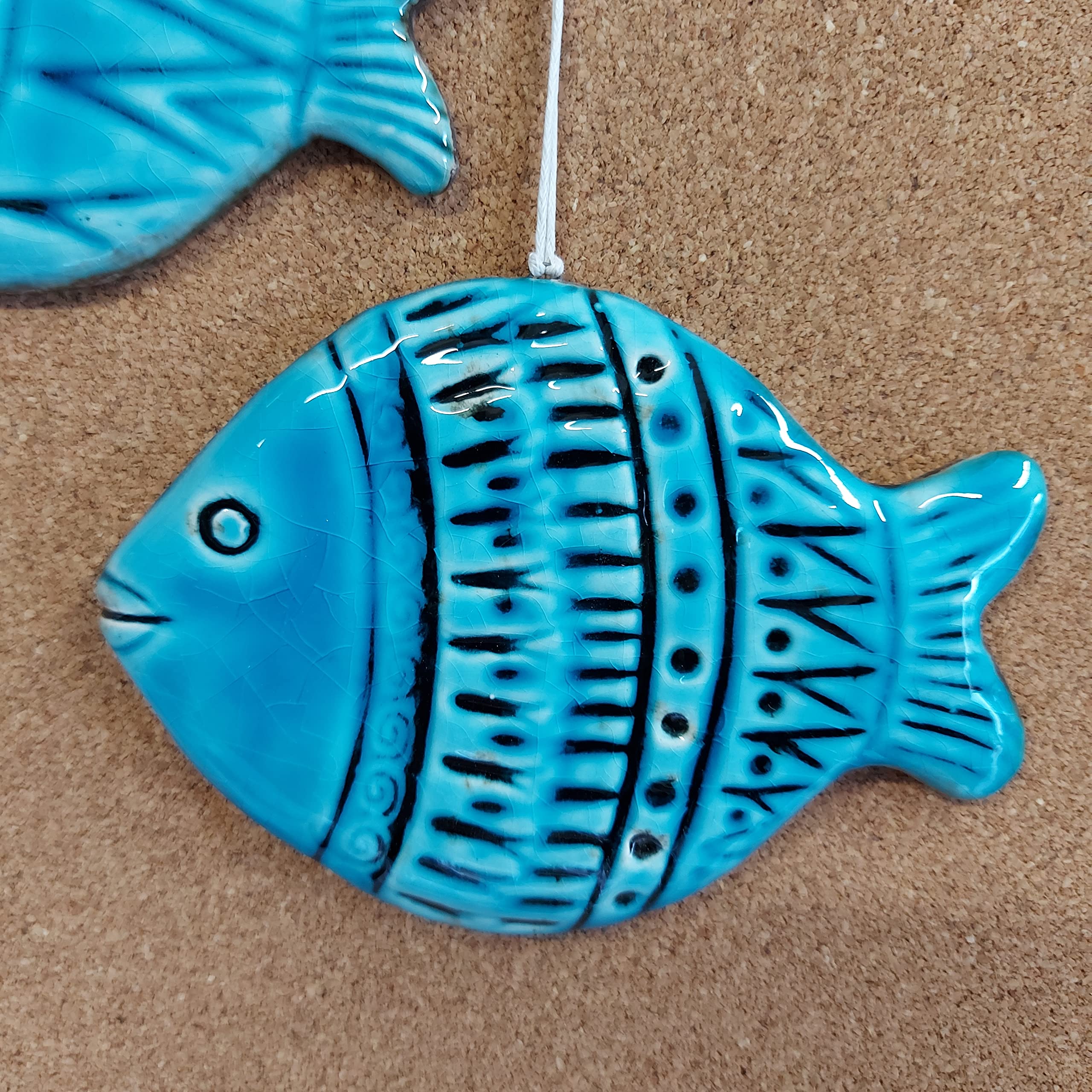 Decorative pair of ceramic fish with crackle glaze and color variations