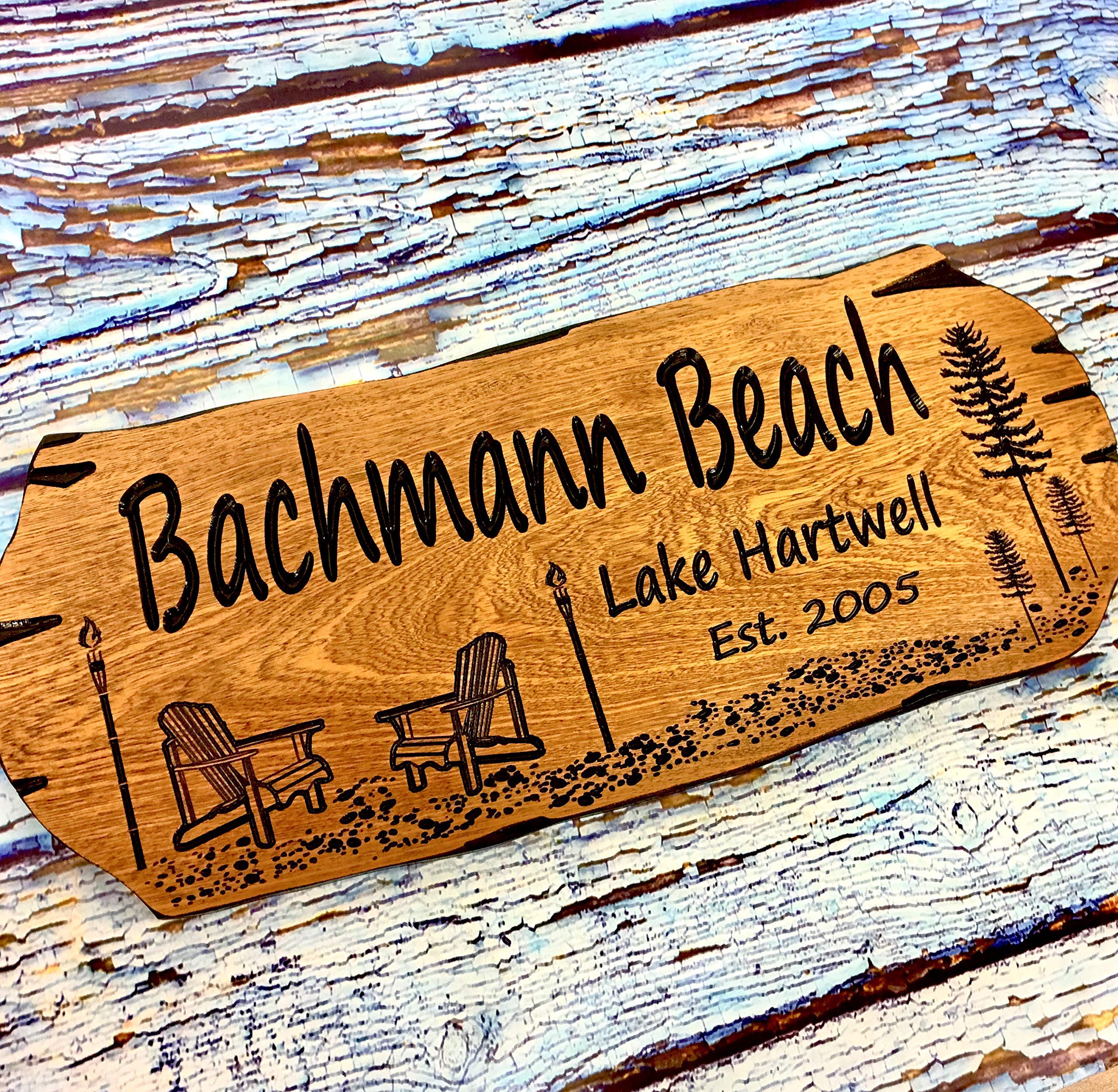 Outdoor mahogany beach house sign mounted on wall