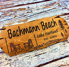 Outdoor mahogany beach house sign mounted on wall