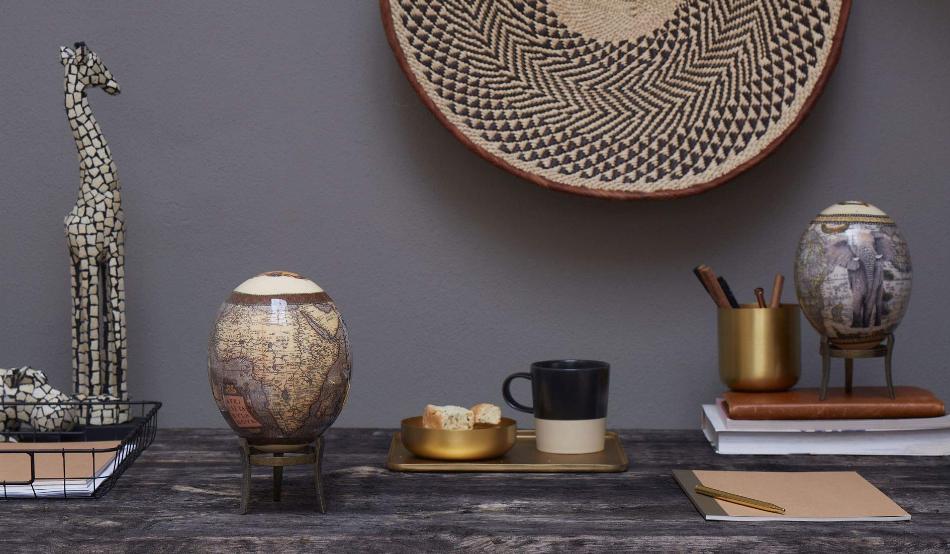Ostrich egg on wooden base or brass display stand