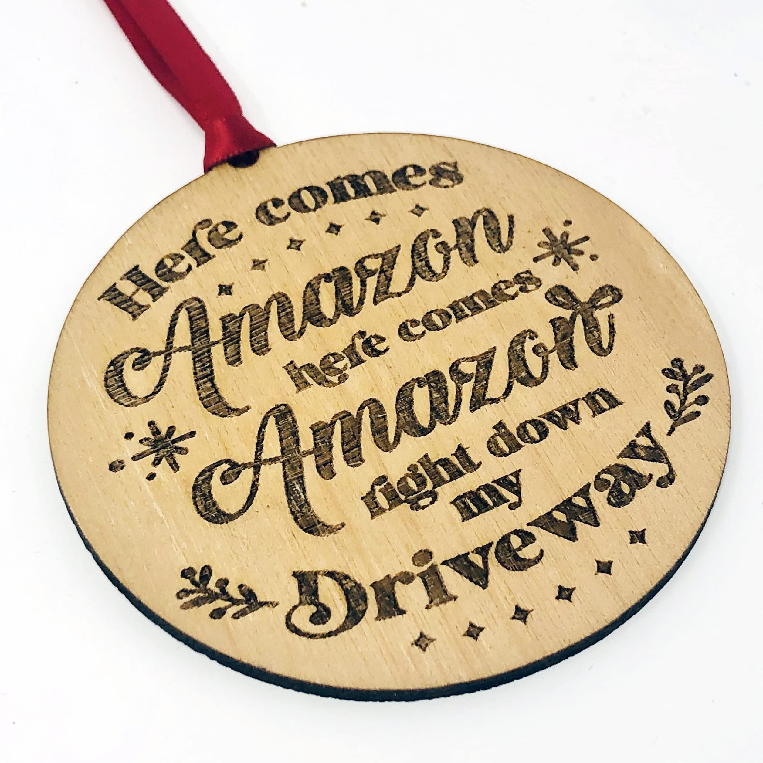 Wooden engraved rustic Christmas ornament with red ribbon