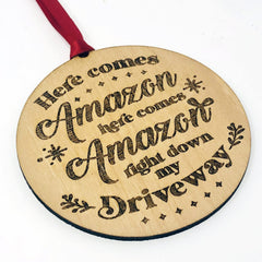 Wooden engraved rustic Christmas ornament with red ribbon