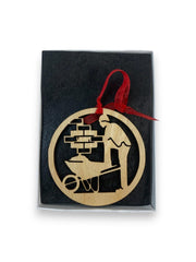 Laser-cut birch wood ornament showing brick layer with wheel barrel