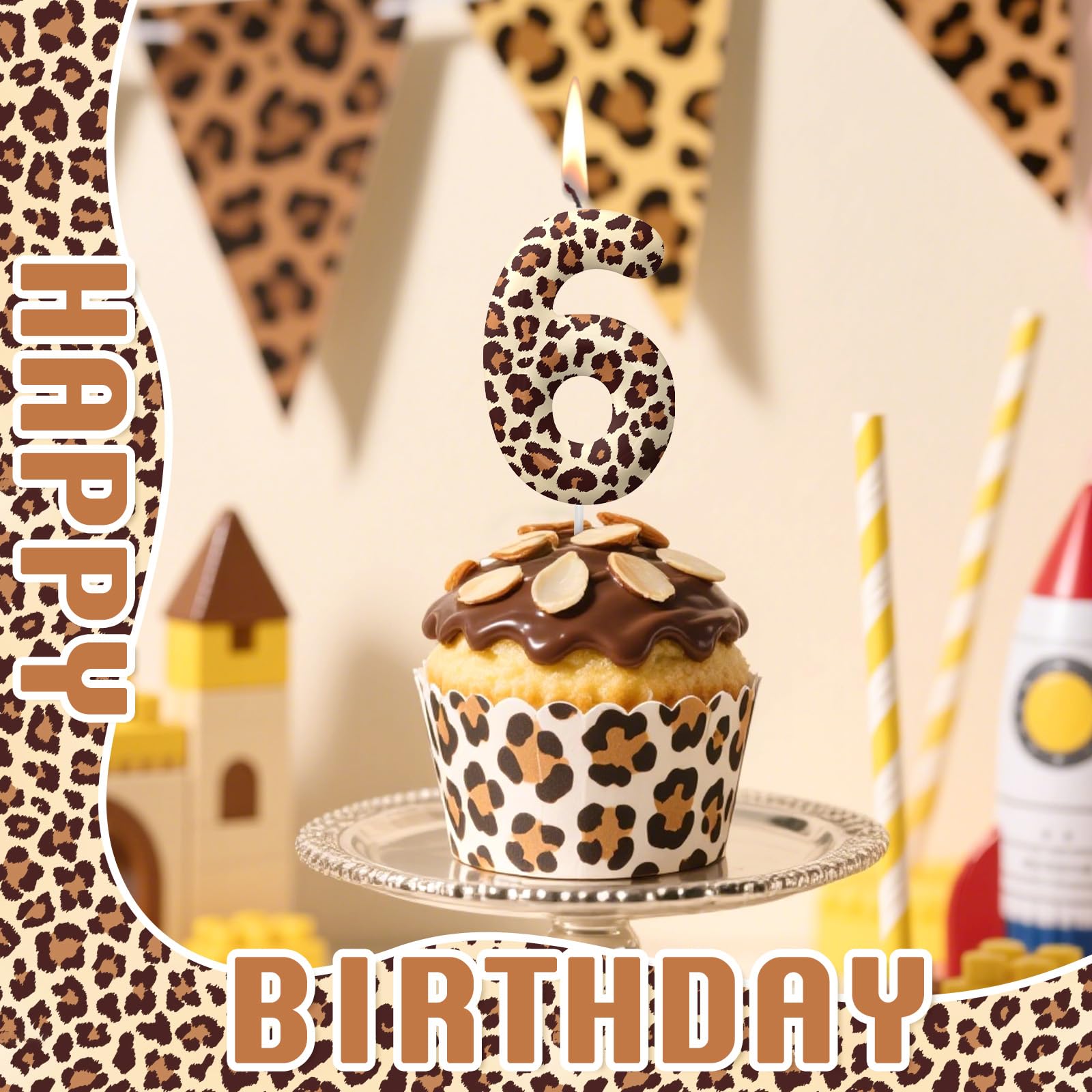 Birthday decorations with leopard print candles on cake