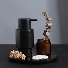 Black ceramic soap dispenser bathroom setting