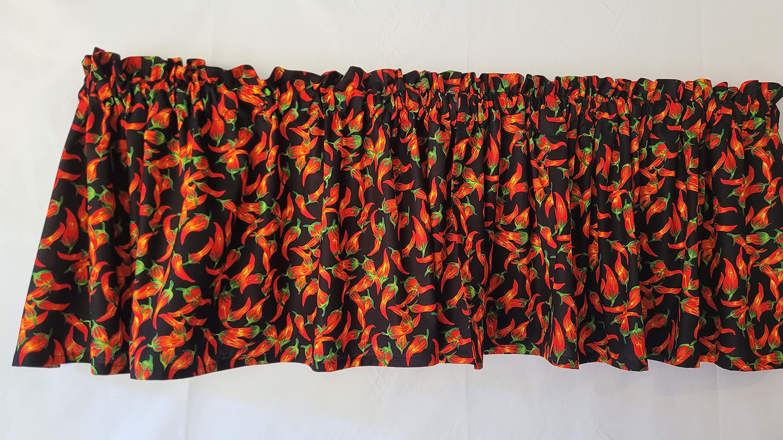 Black valance with red chili pepper pattern