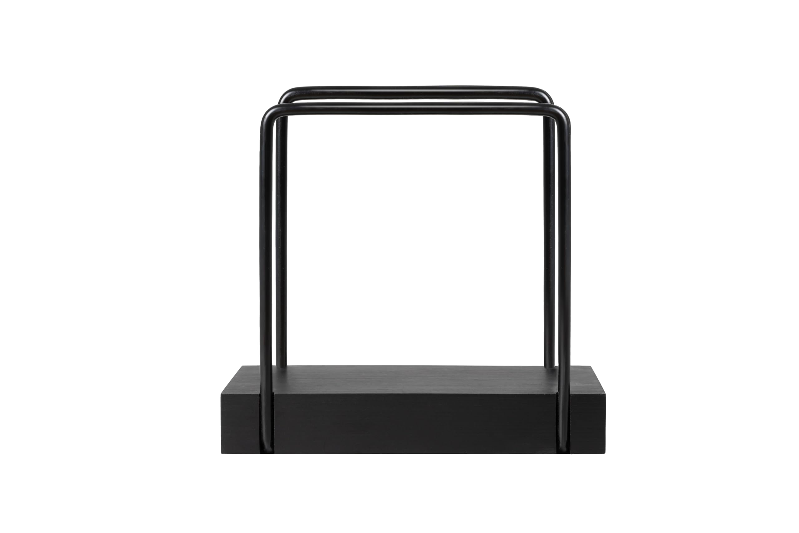 Black metal napkin holder on tabletop with bamboo base