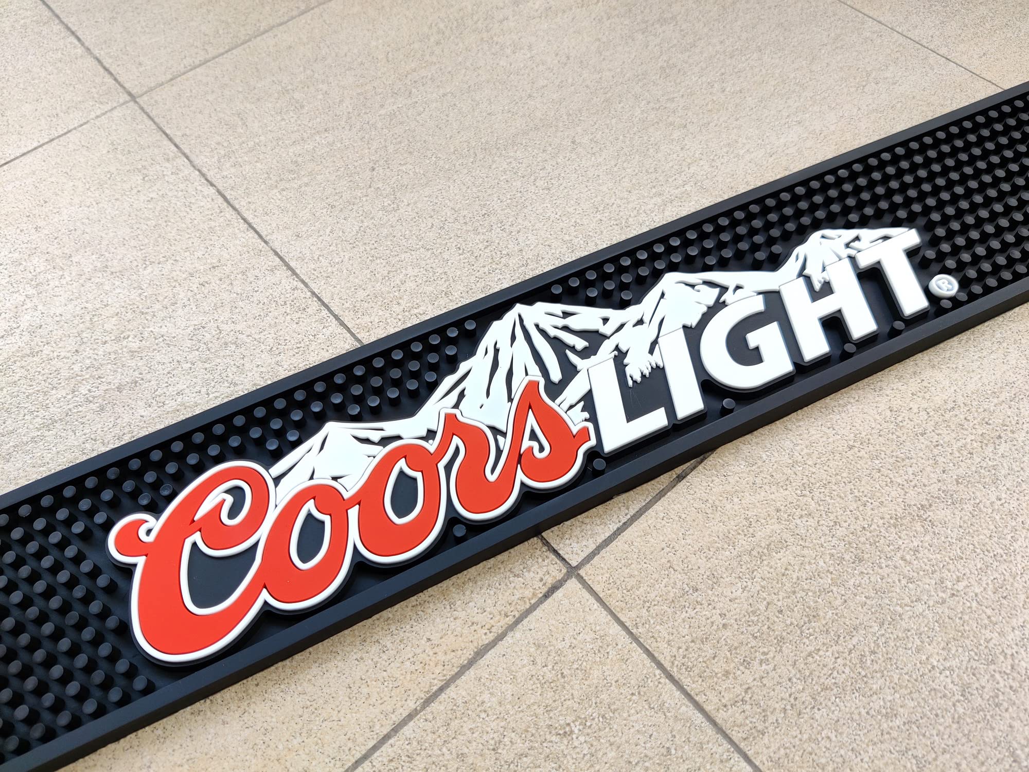 coors lght mountain logo on bar mat close up