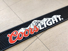 coors lght mountain logo on bar mat close up