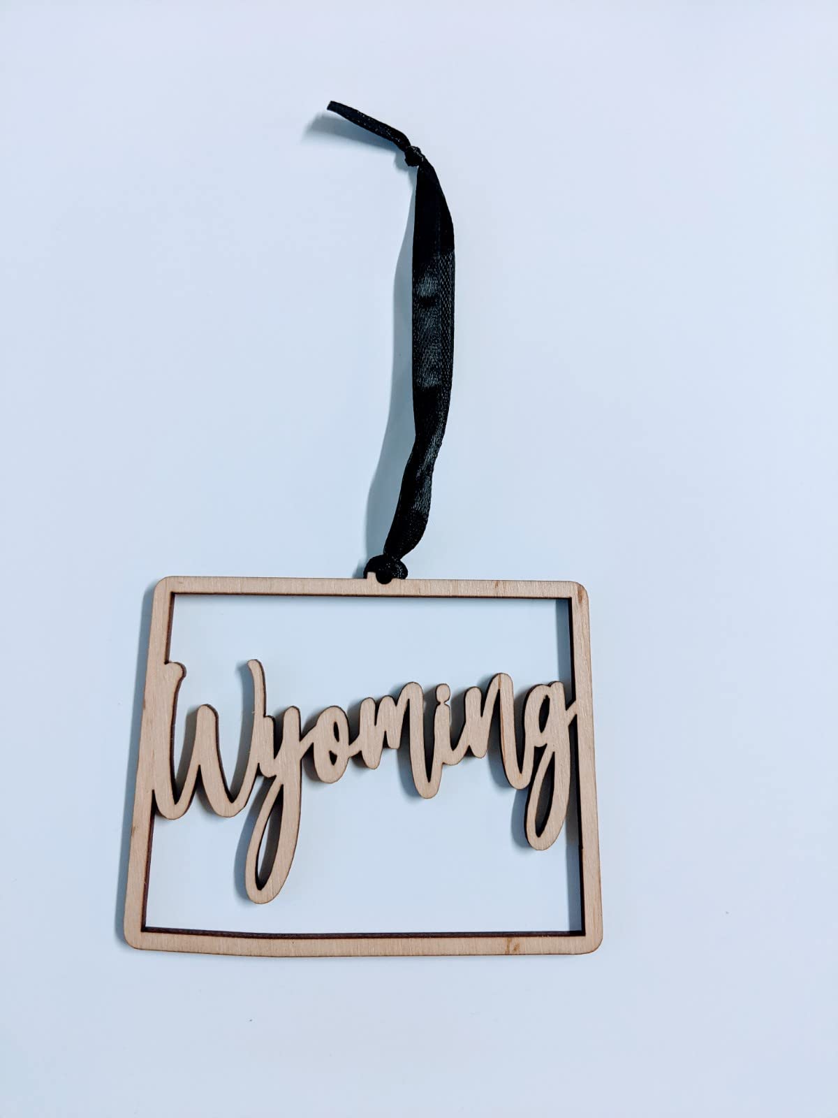 State ornament Wyoming for rustic holiday decor with black ribbon