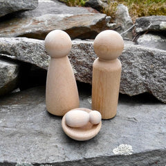 Two large peg dolls measuring three and a half inches tall