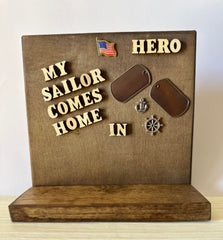 Natural color lettering reads My Sailor Comes Home In