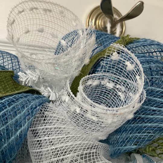 Blue and white winter wreath with snowflakes and moss green ribbons