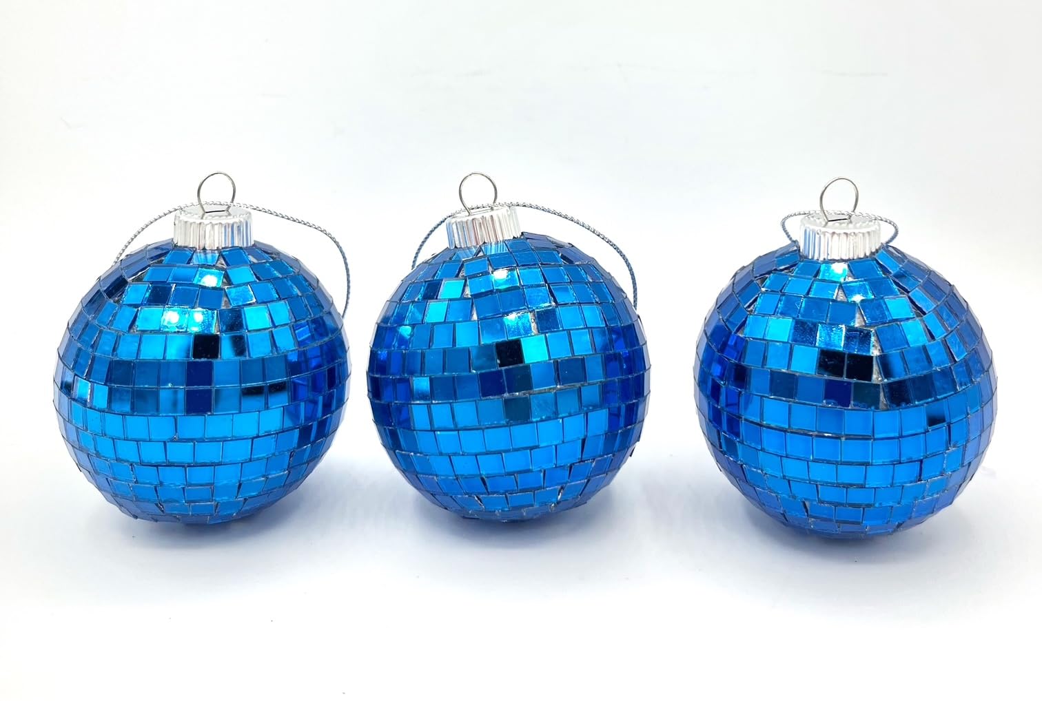 Disco-ball style reflection on blue mosaic ornament