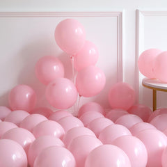 Blue latex balloons with boot pattern and pink latex balloons with bow pattern
