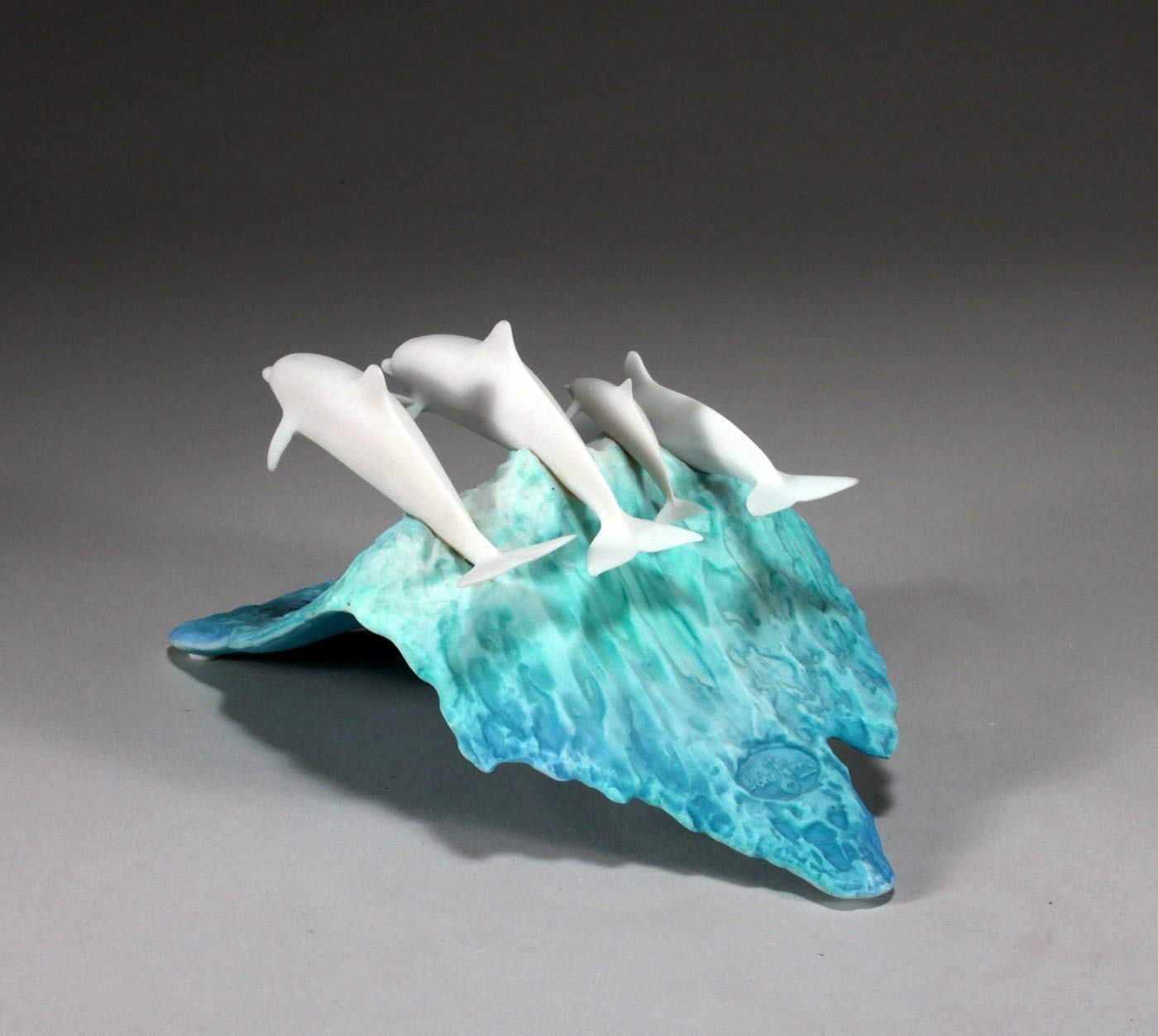 Pellucida resin dolphin sculpture with signed provenance