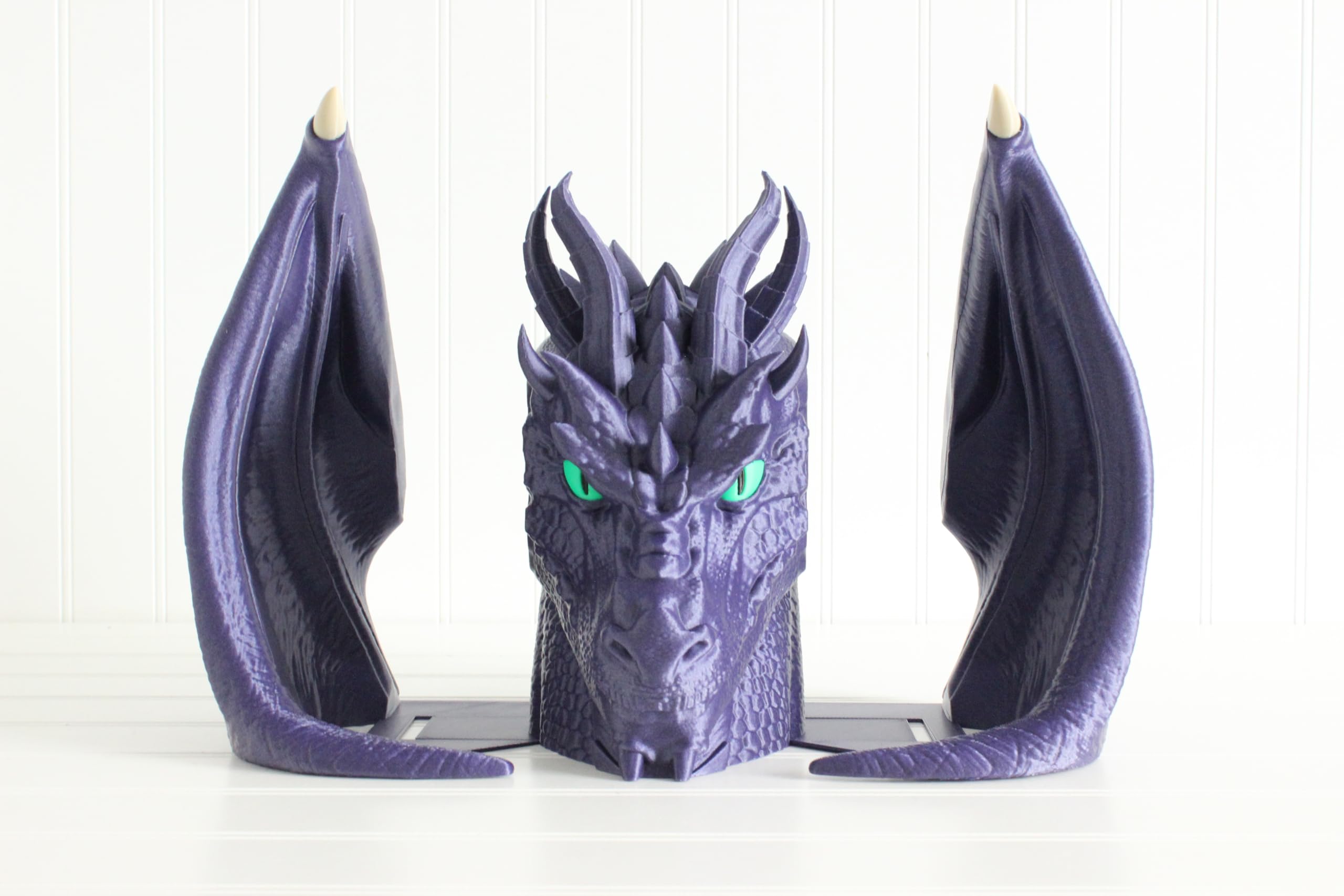 Bookish dragon decor on bookshelf with books