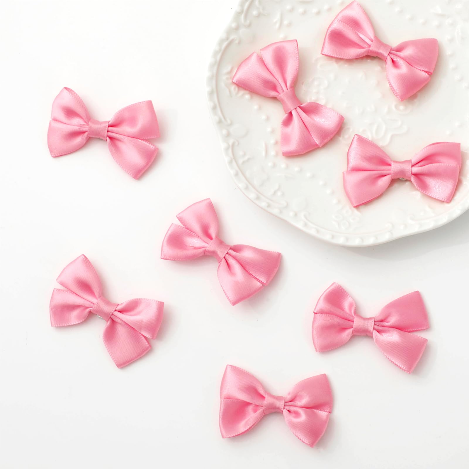 Ribbon bow magnets for refrigerator cabinets and whiteboards
