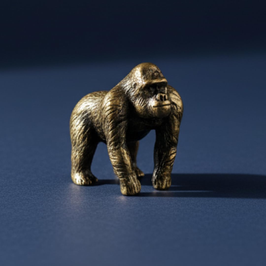 Compact brass gorilla figurine weighing 12.8 g