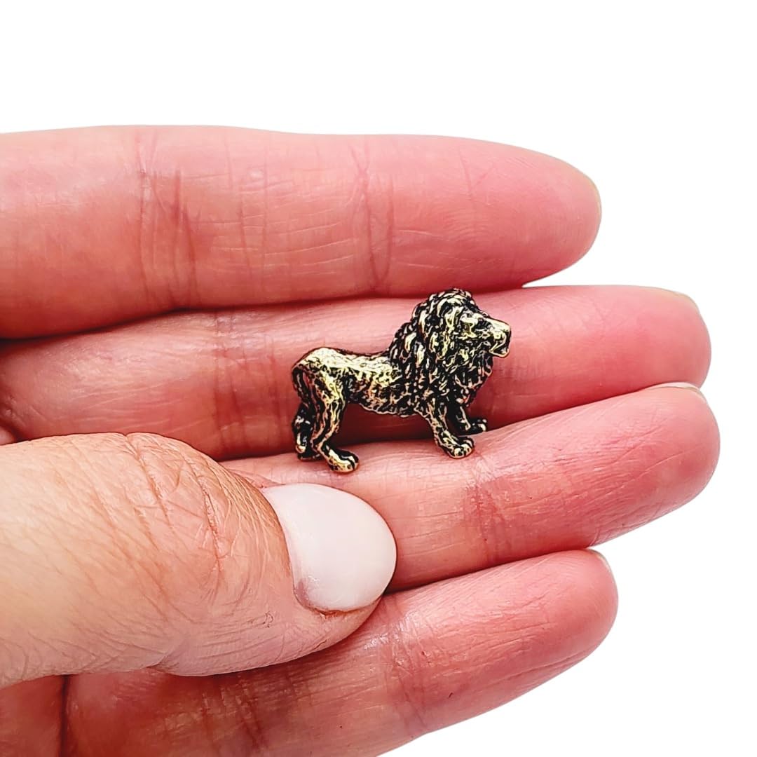 Brass lion figurine closeup showing handcrafted details