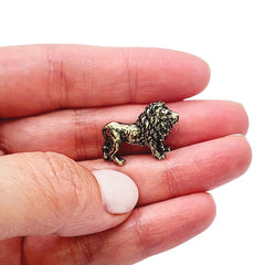 Brass lion figurine closeup showing handcrafted details