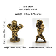 Solid brass bodybuilder figurine close up with weightlifting pose