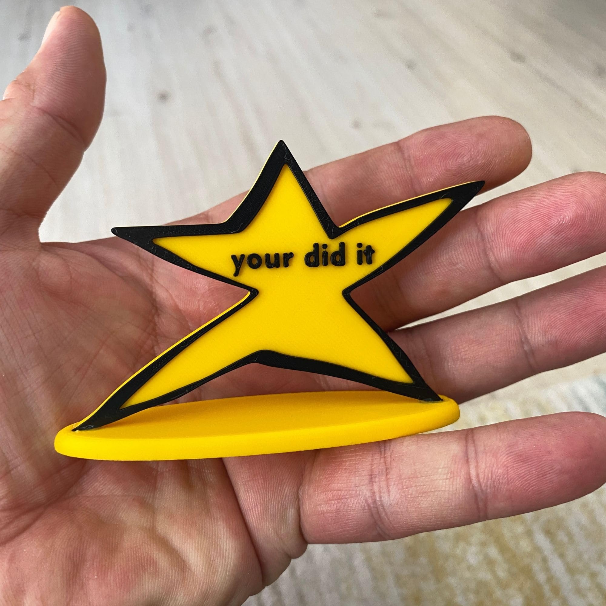 Bright yellow meme trophy with bold black lettering