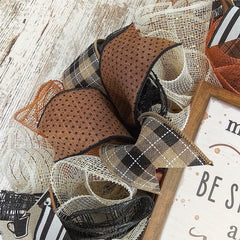 Wreath featuring brown white black color palette