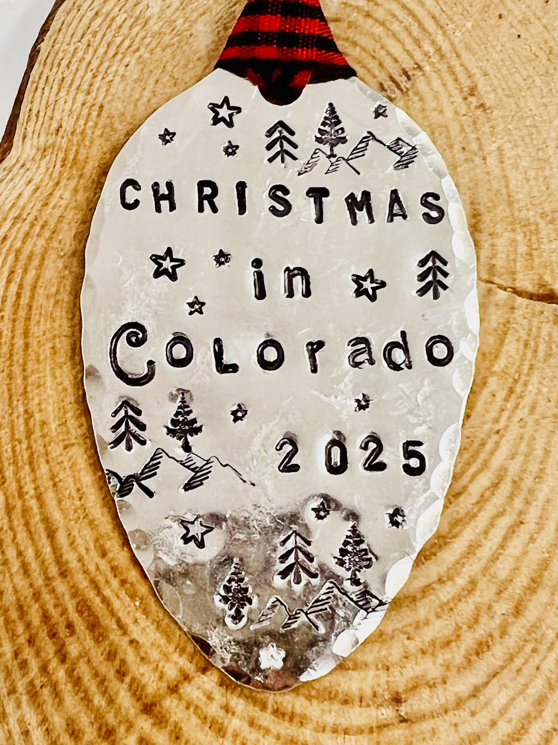 Hand stamped spoon ornament featuring mountains and stars