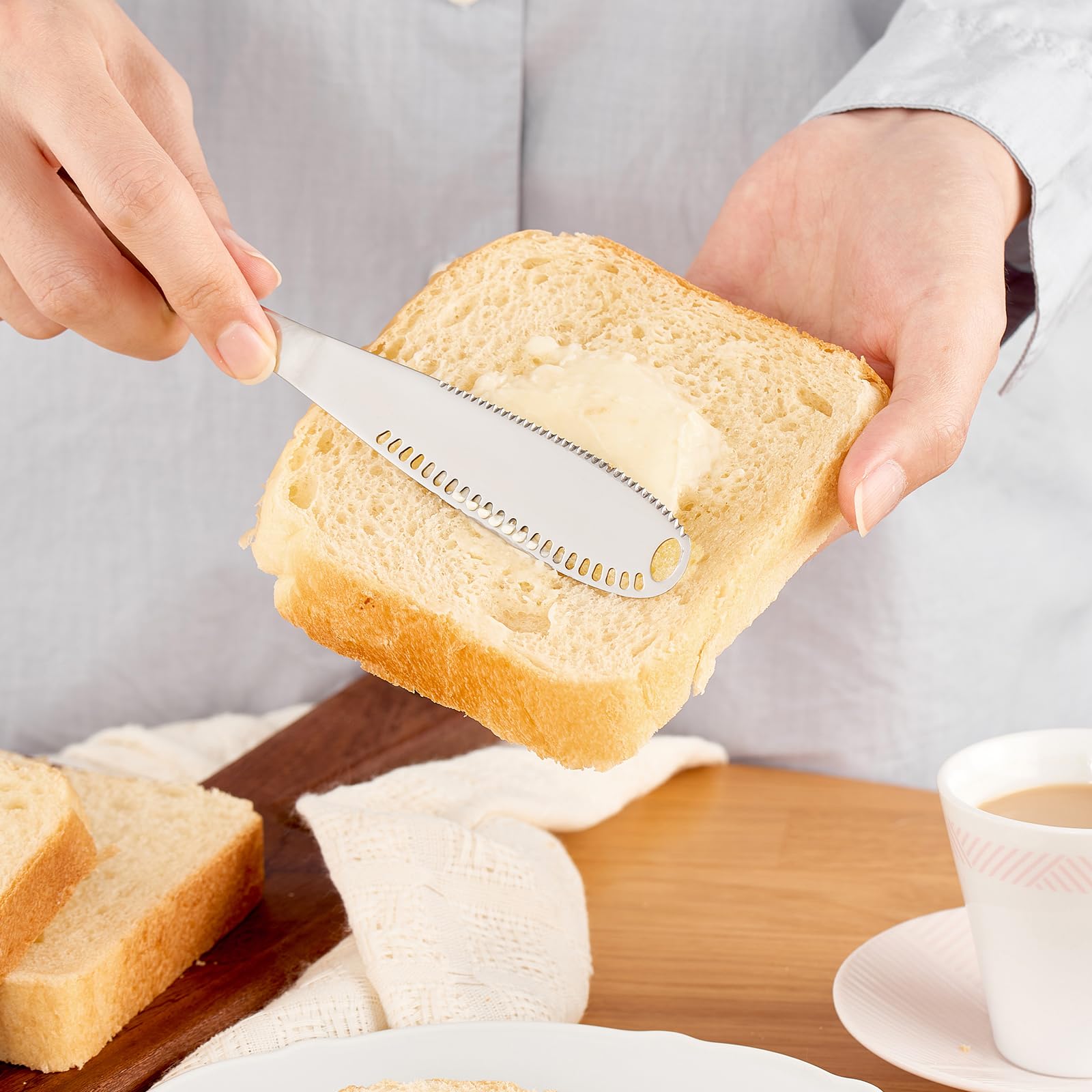 3-in-1 butter spreader with holes and serrated blade