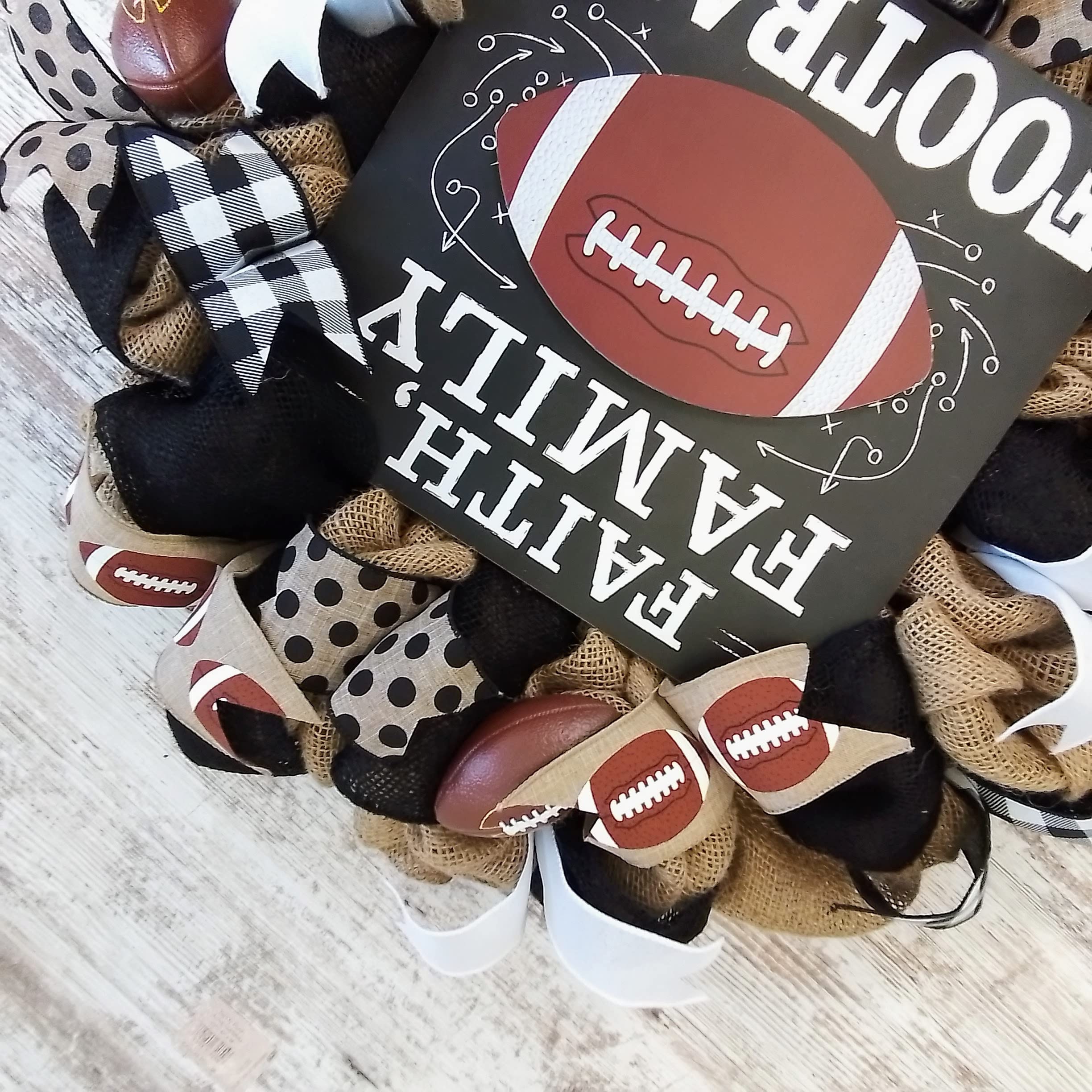 Burlap mesh wreath featuring football ribbons