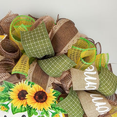 Yellow colorfast burlap accents on sunflower wreath