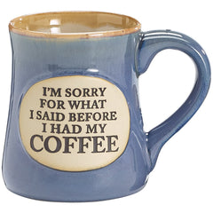 Burton & Burton coffee mug teal with tan trim and front oval medallion inscription