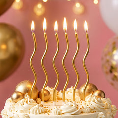 CAKE CODE 12-count Gold Spiral Candles with holder closeup