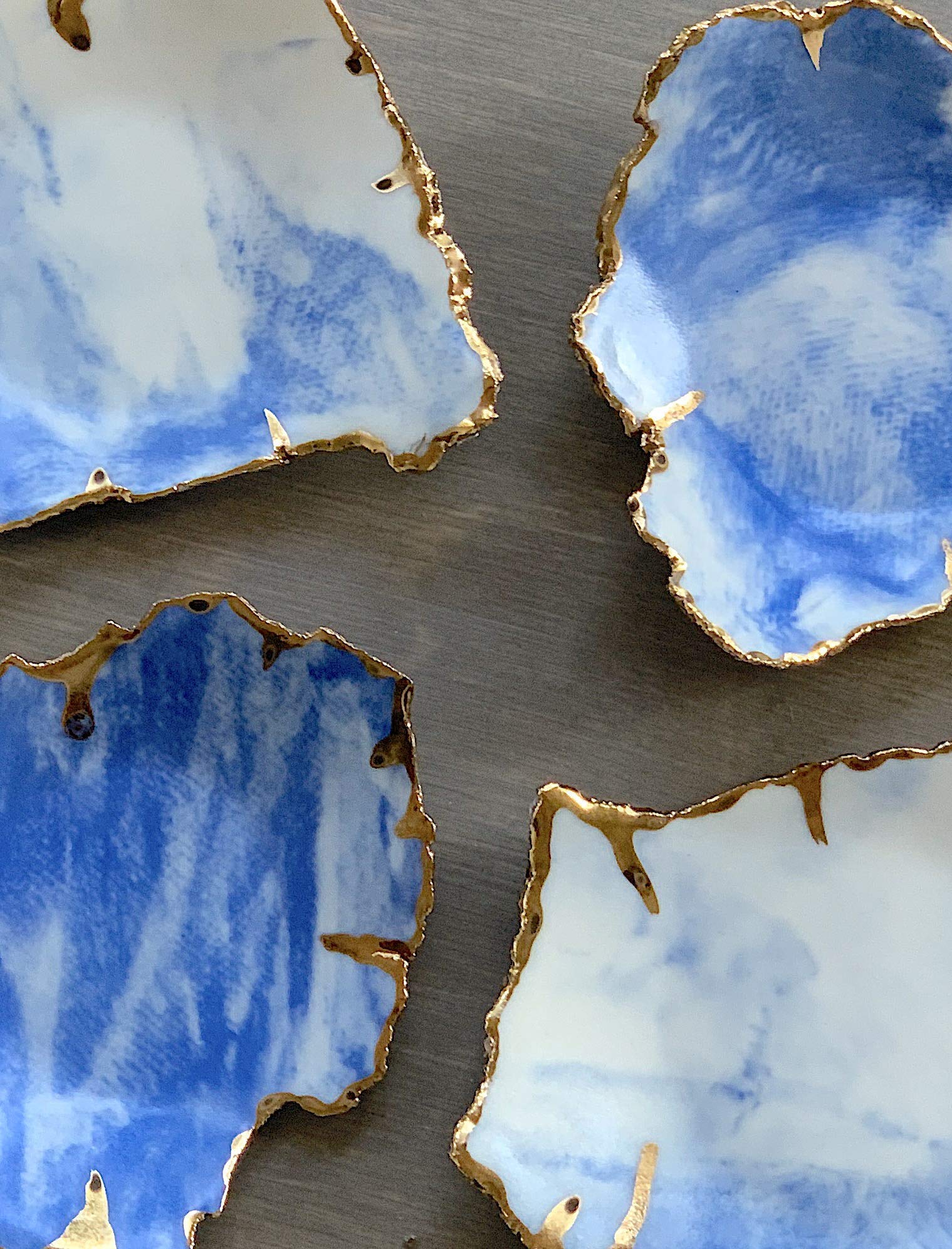 Stock photo of white blue and gold marbled dish