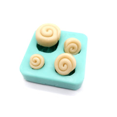 Candle making embeds in cinnamon roll silicone mold