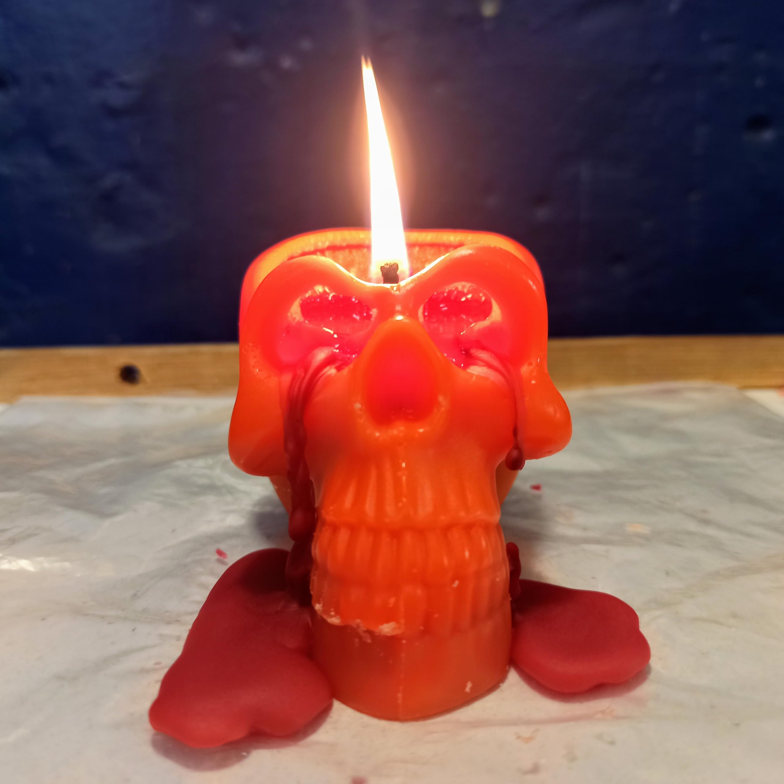 Candle for spells orange red bleeding skull