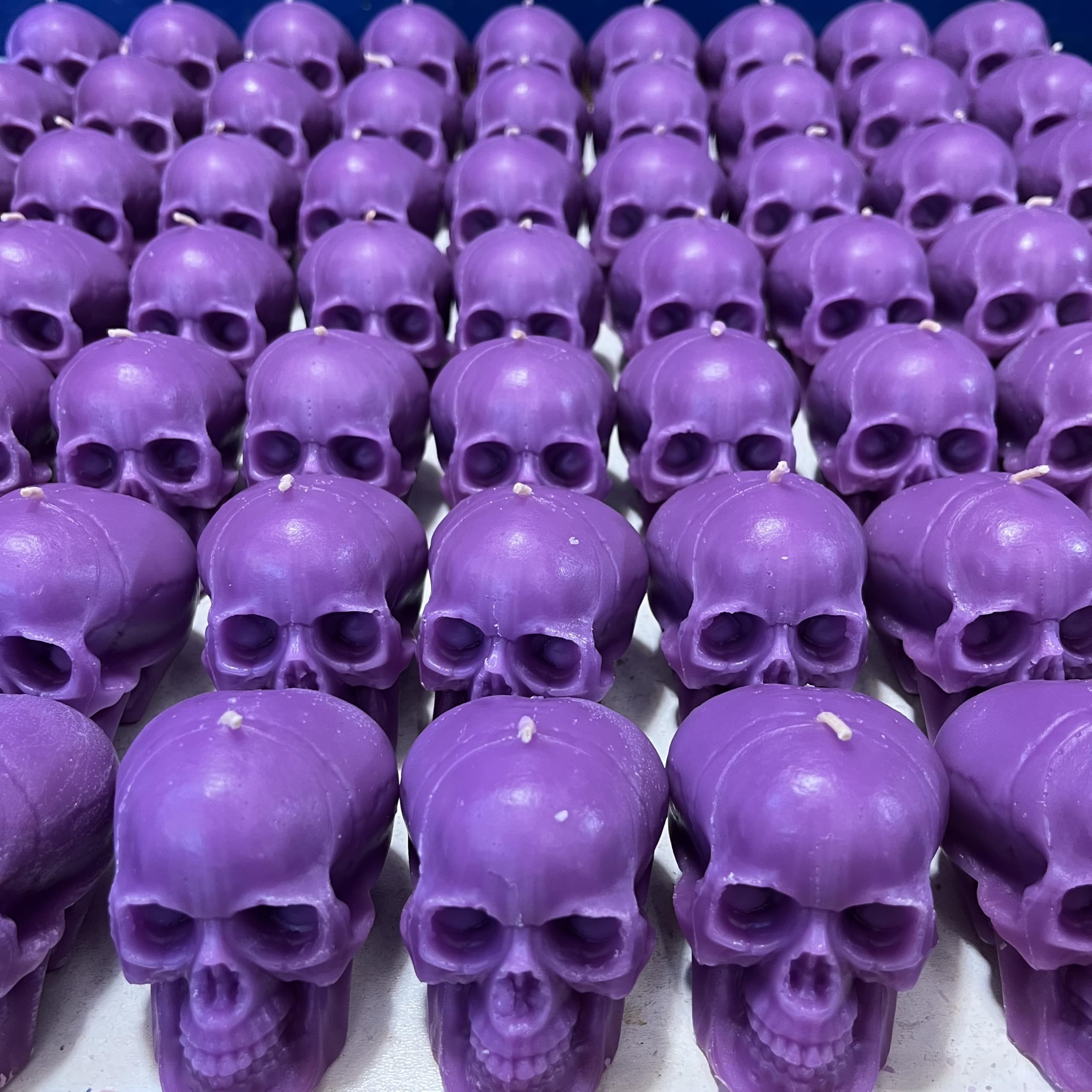 Gothic purple skull candle pair for decor and ritual