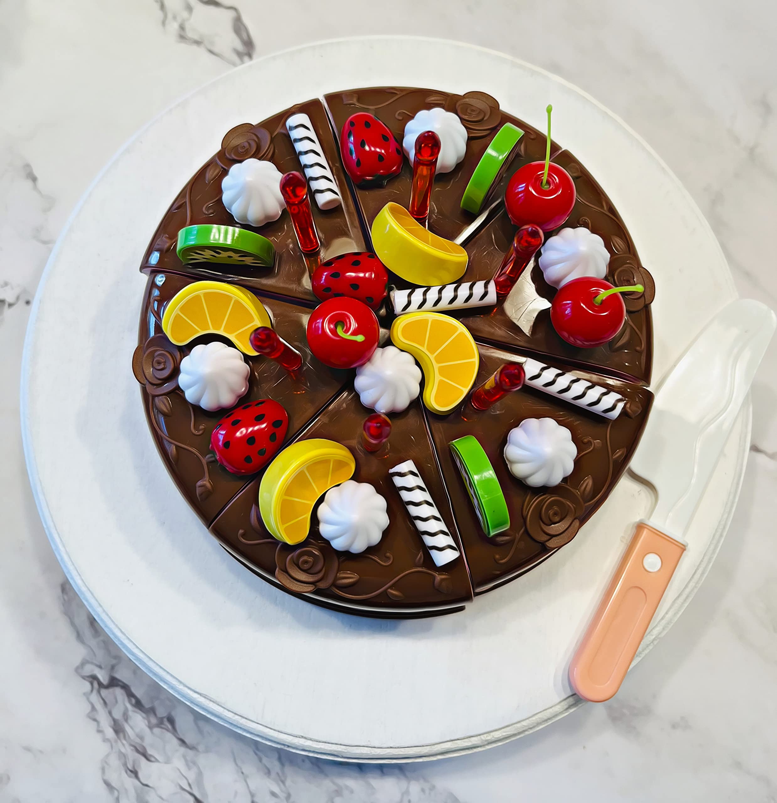 Candles and toppings included with cake prop