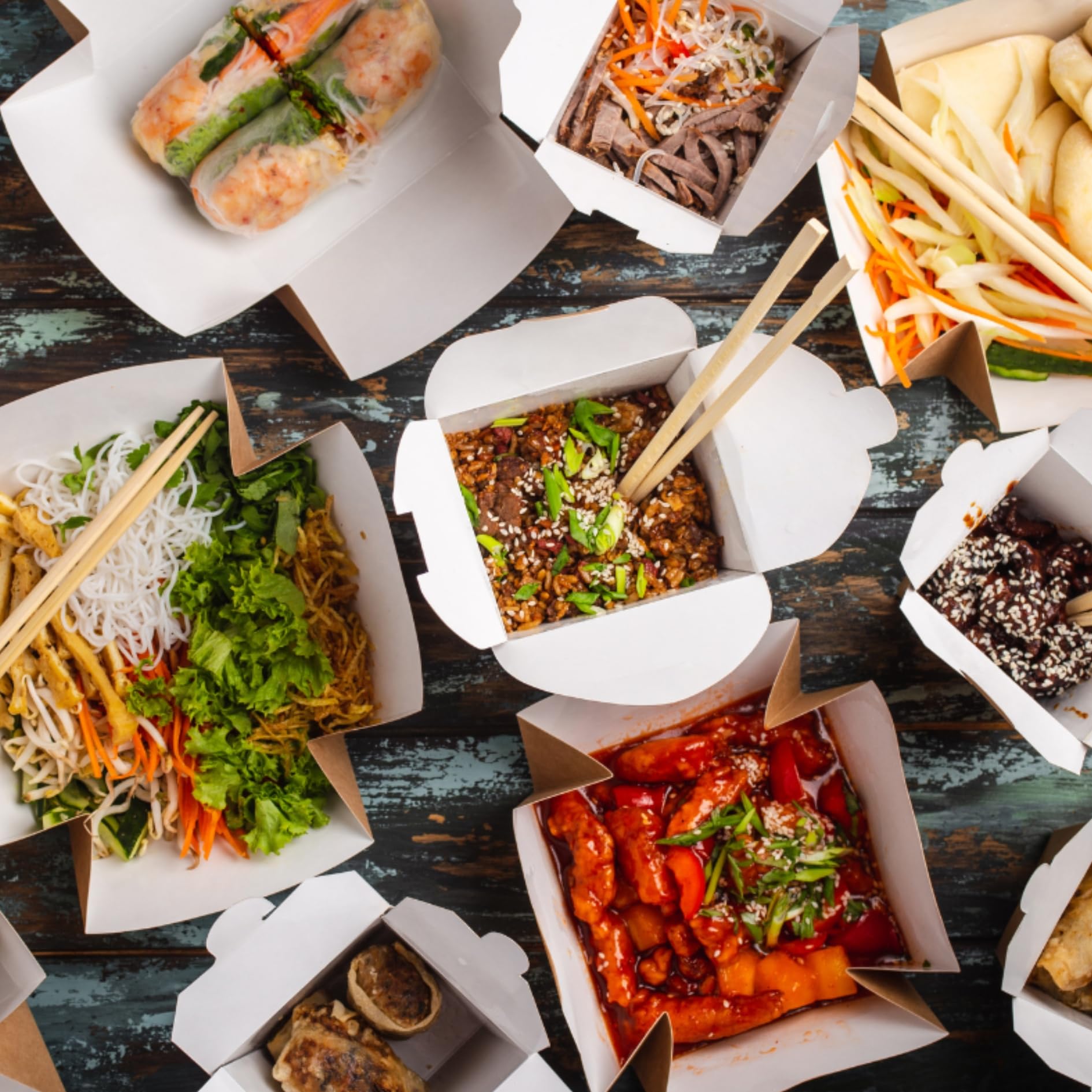 Stackable white takeout boxes with wire handle in packaging